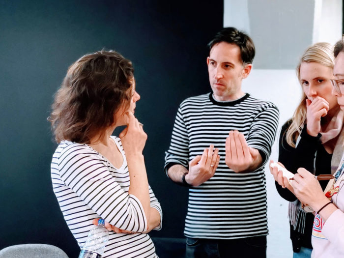 Funding team standing and talking