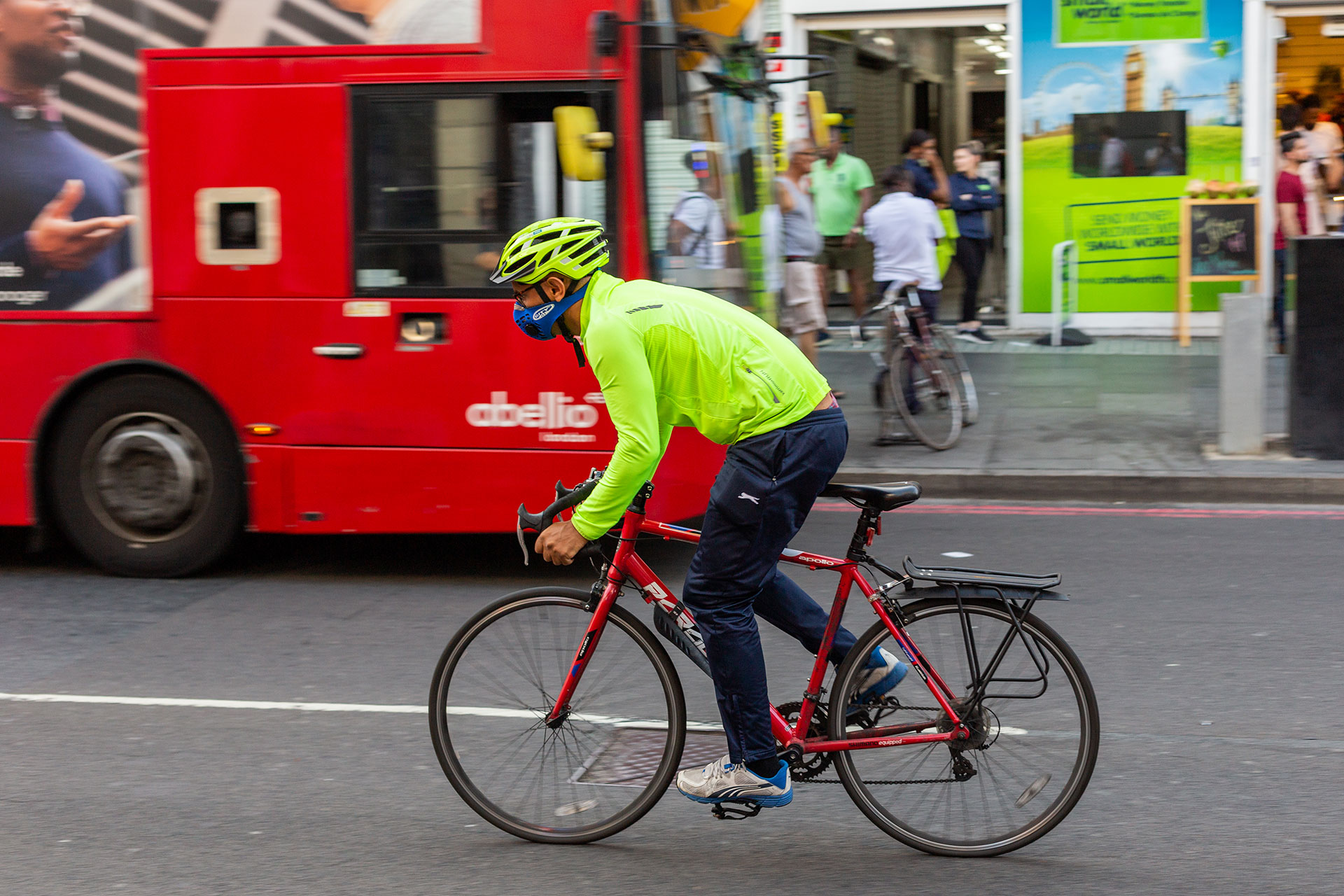 Man cycling and wearing a face mask
