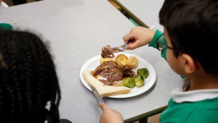 Boy eating school food