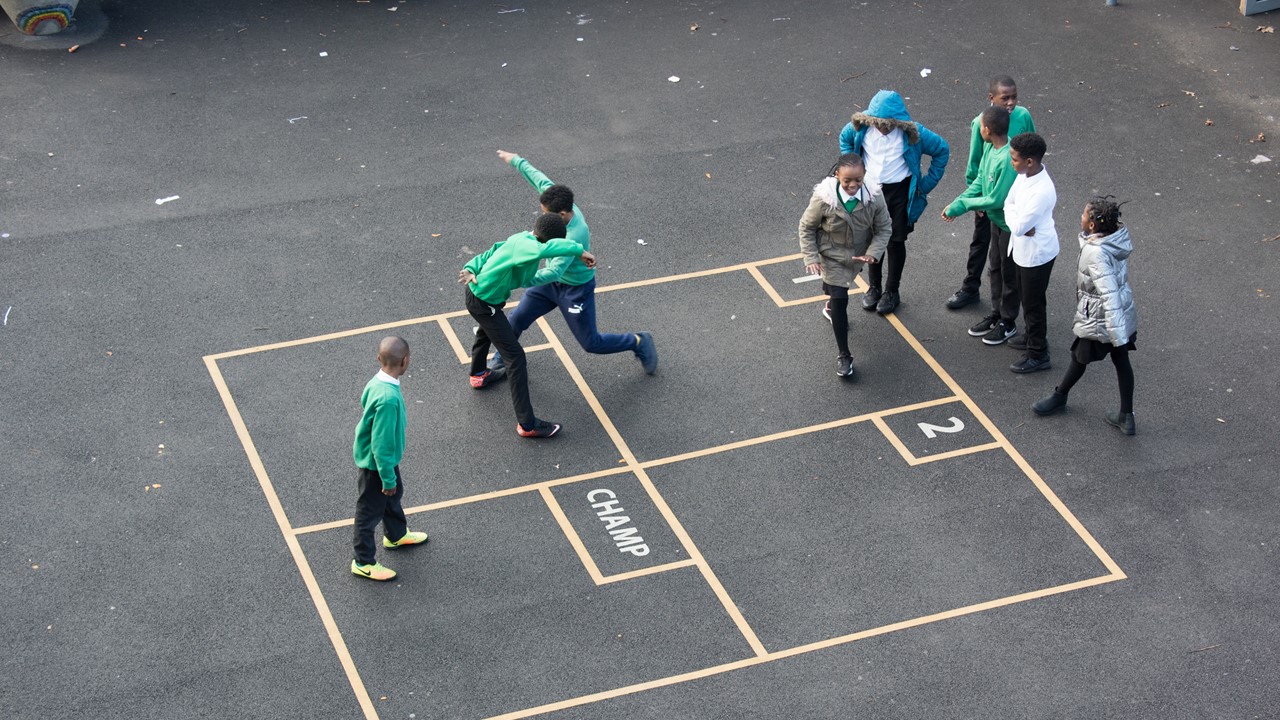 kids playing four square
