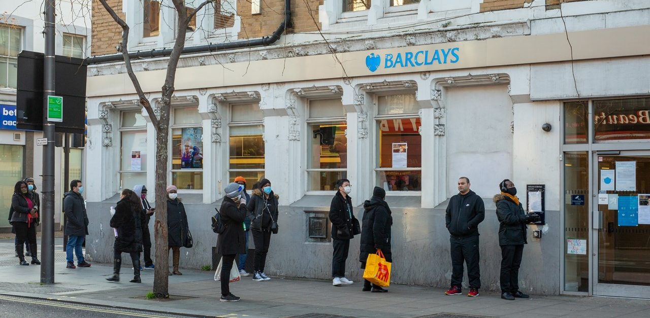 People queuing outside Barclays bank