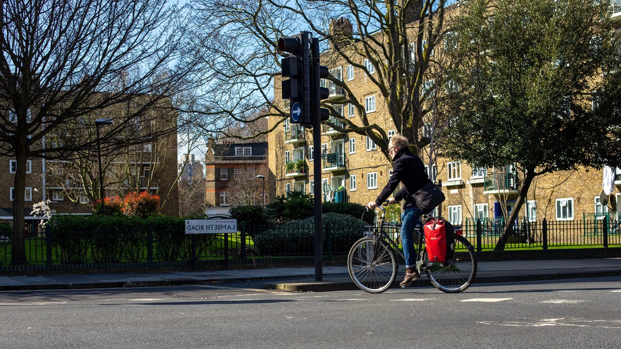 Man on bike waiting at junction