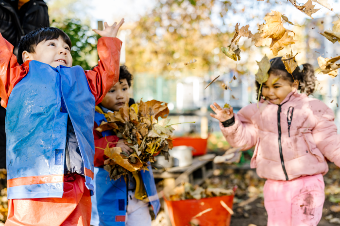 Children playing with leaves