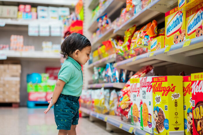 Small%20child%20looking%20at%20produce%20on%20supermarket%20shelves