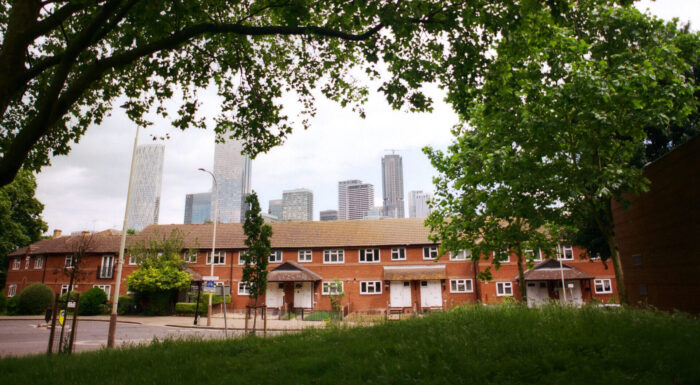 Houses surrounded by canopy of trees. Photograph by Francis Augusto