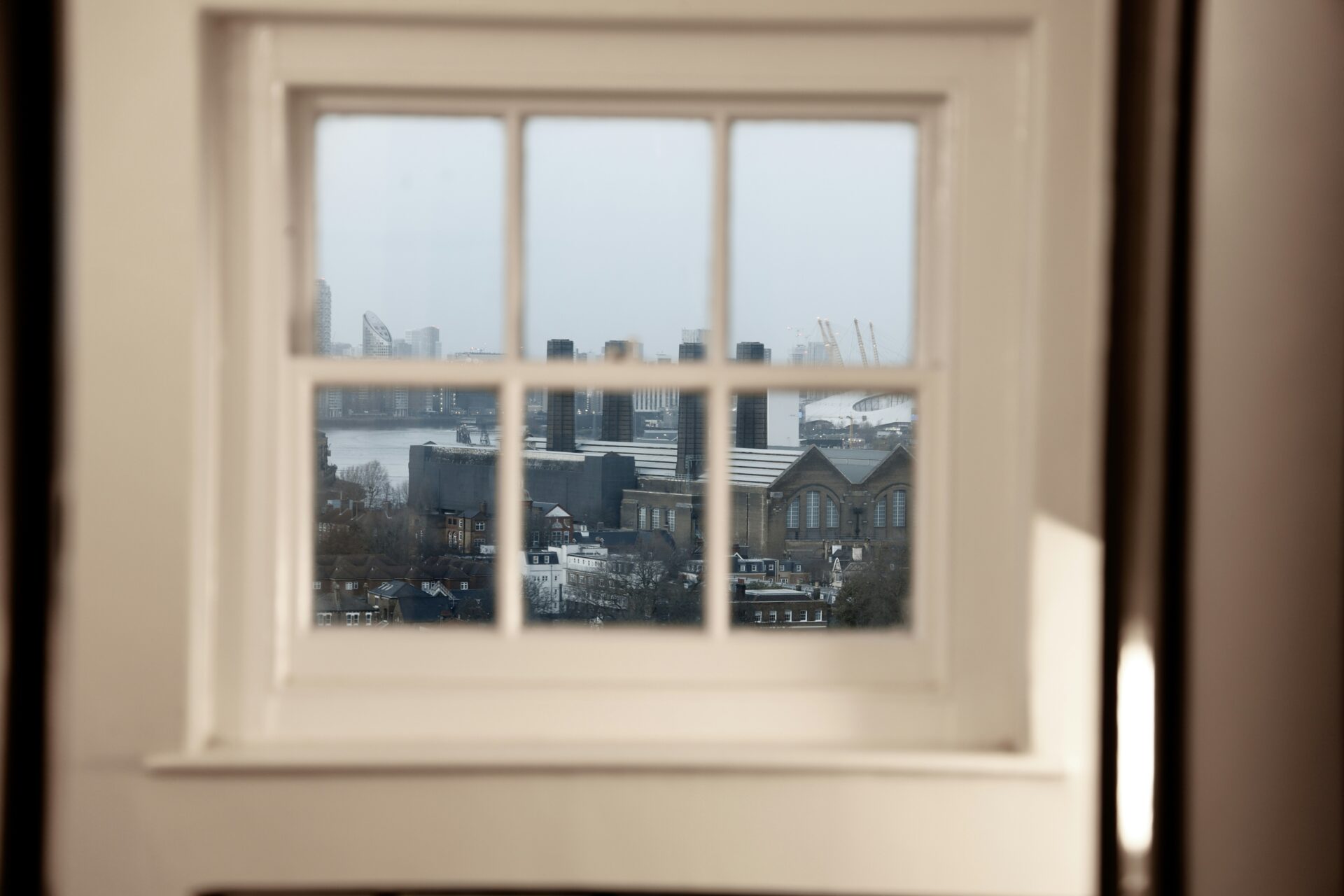 A window looks out onto Greenwich power station. Photograph by Iuliia Dutchak