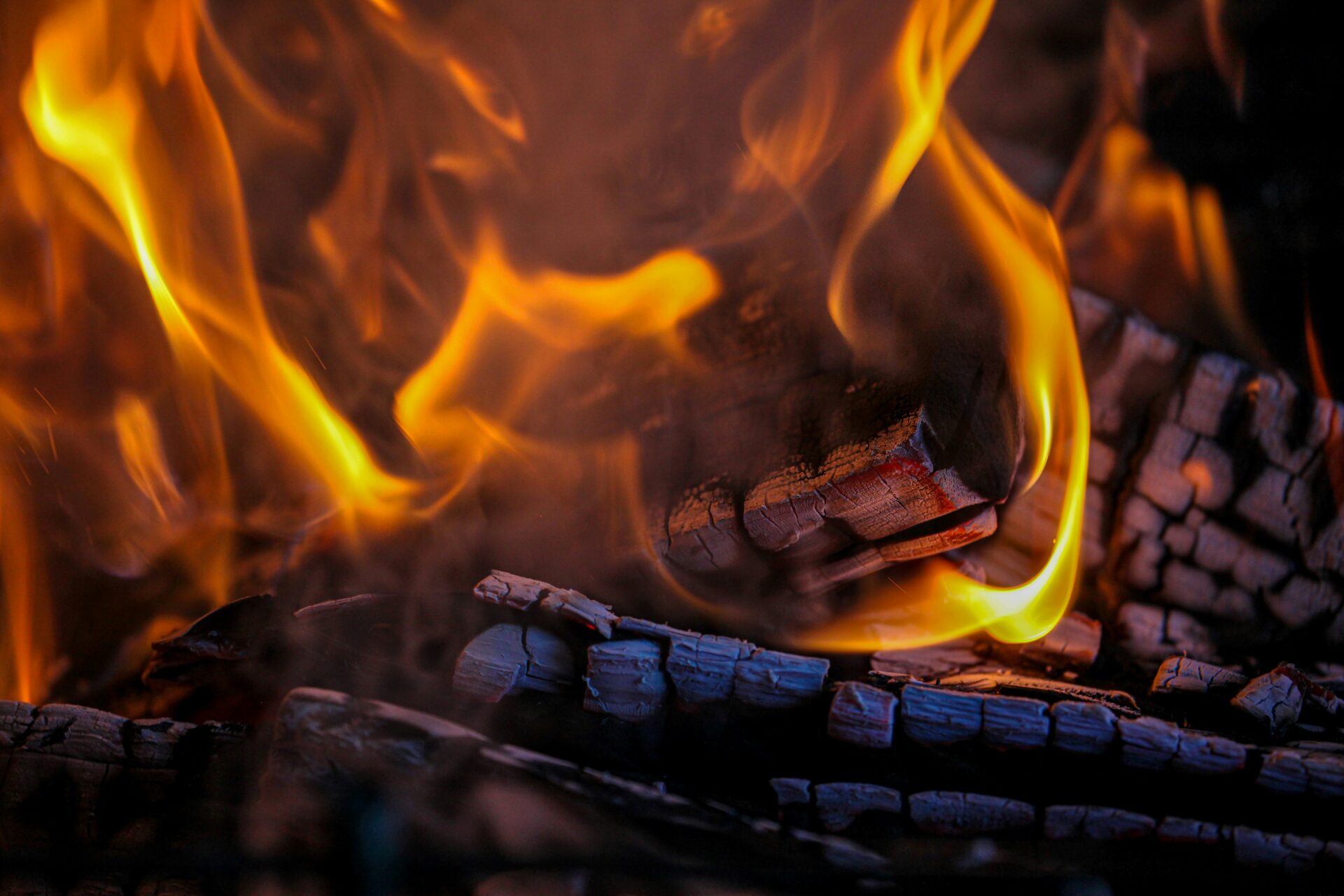 Logs burning. Photo by Anastassia Anufrieva on Unsplash